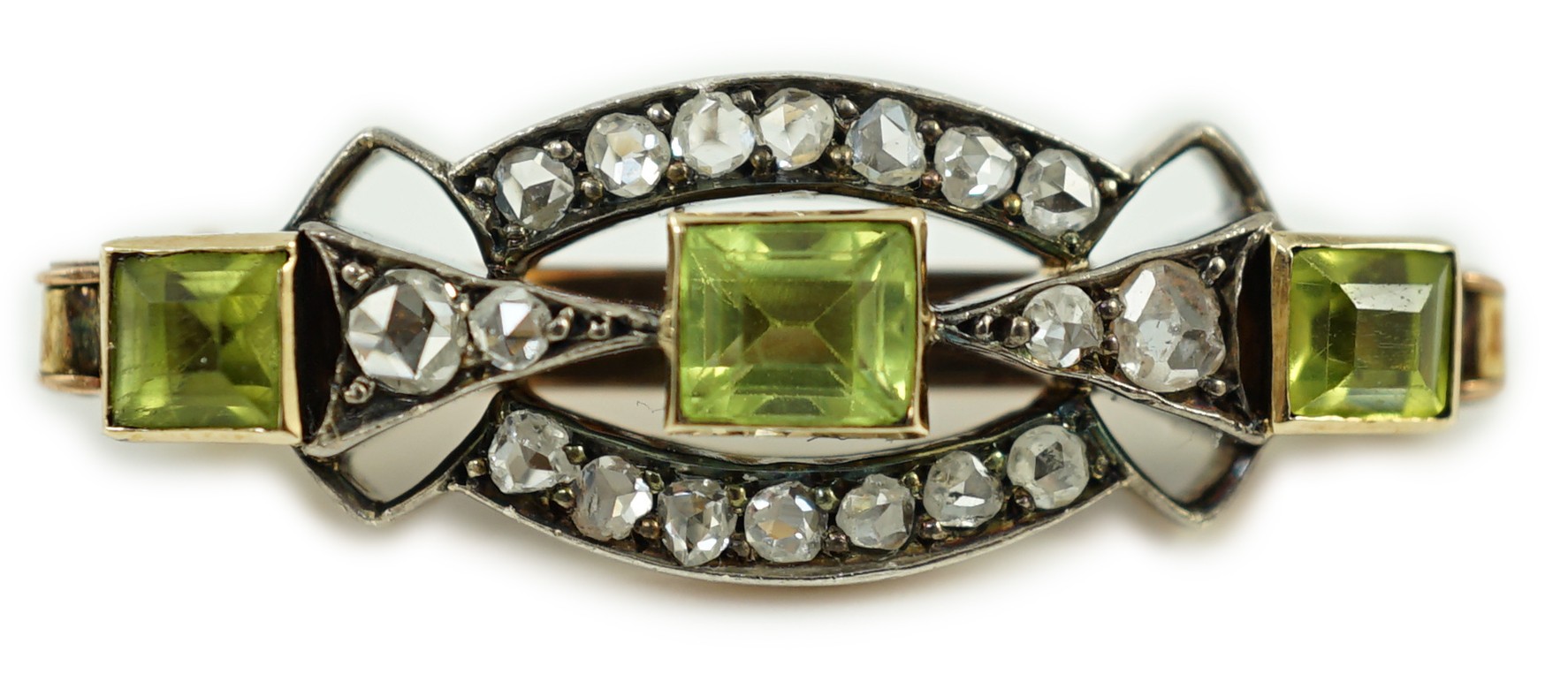 A late Victorian yellow metal, peridot and rose cut diamond set brooch, 31mm, gross weight 4.9 grams.